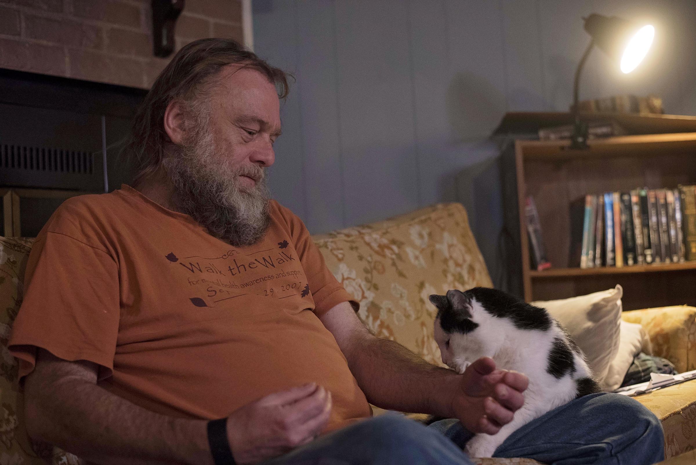 Pete shares a tender moment with his cat Disco at home in The Plains, OH.